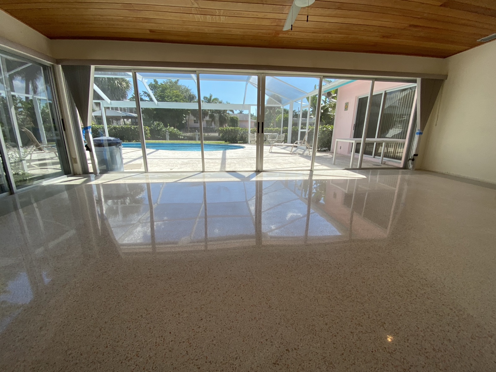 Polished terrazzo Florida room, edges extended with polished cement overlay