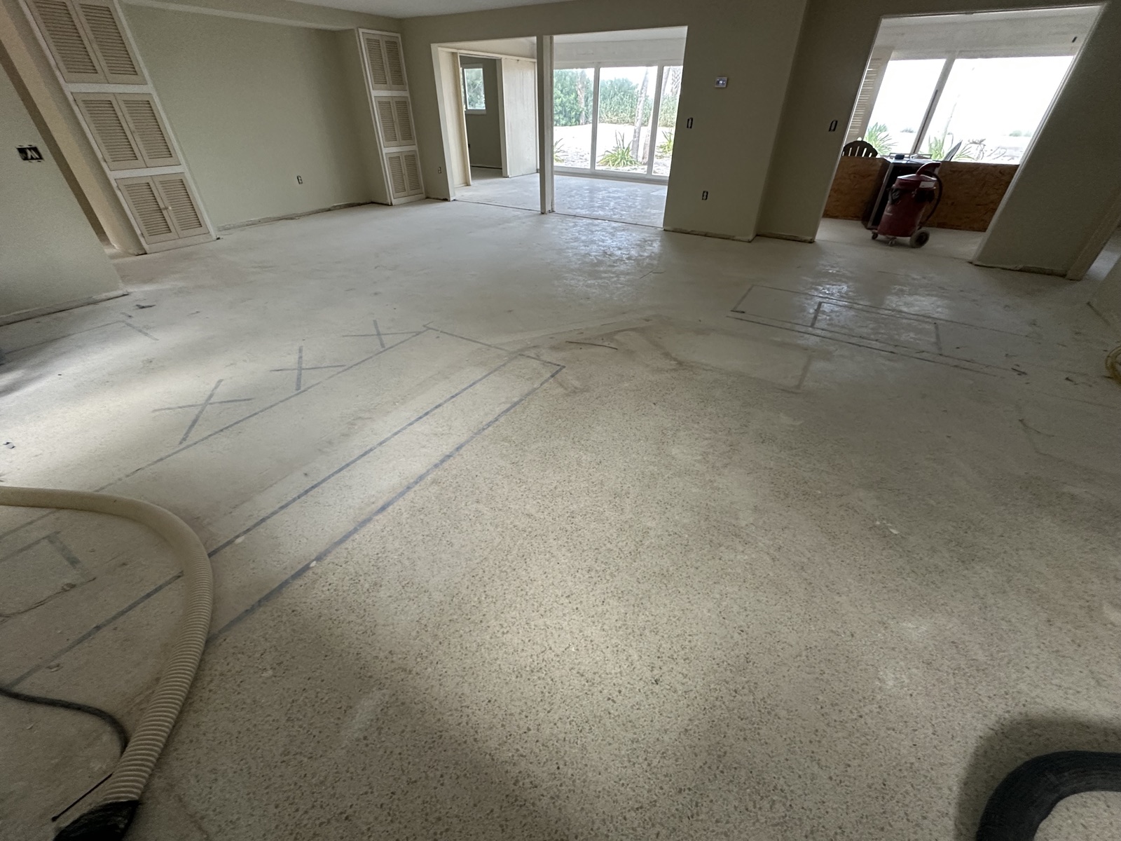 Main room before resurfacing, looking toward the sliding glass doors