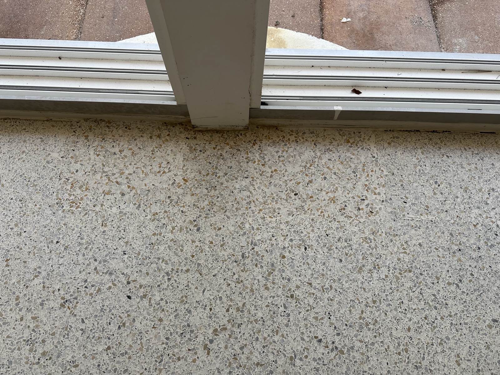 Close-up of the patch of about 2 square feet by the sliding glass door, after polishing
