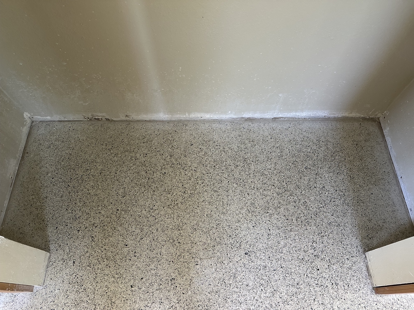 The same closet floor after the holes were repatched and the floor was reground and polished